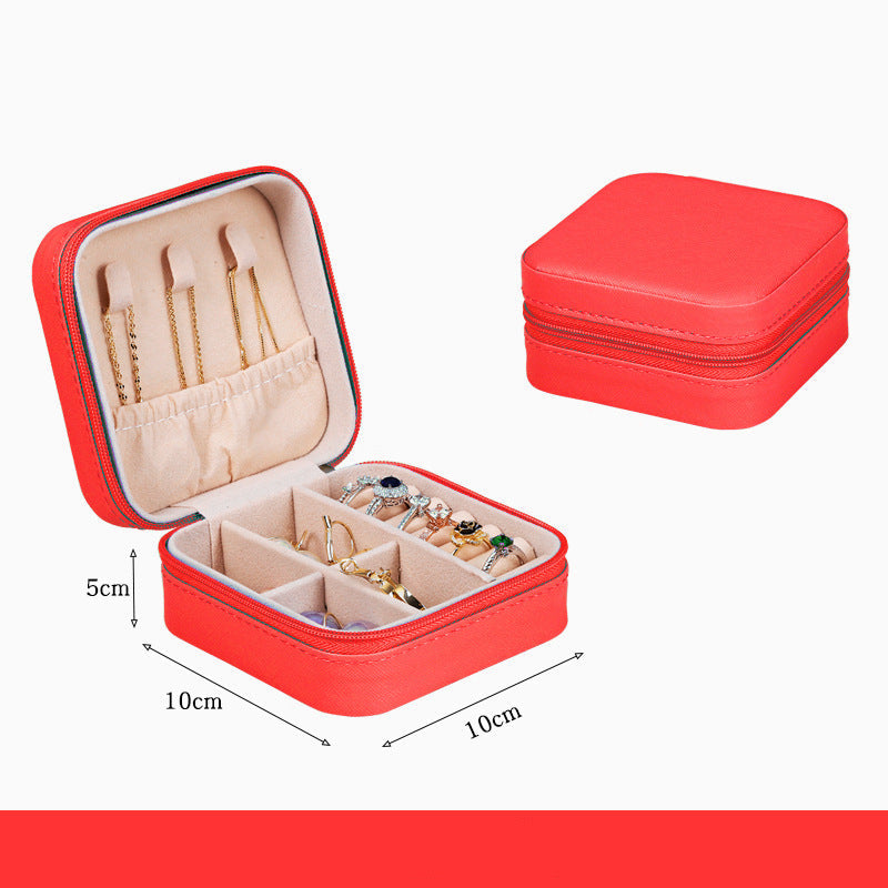 Red jewelry box with earrings and dimensions on a white background