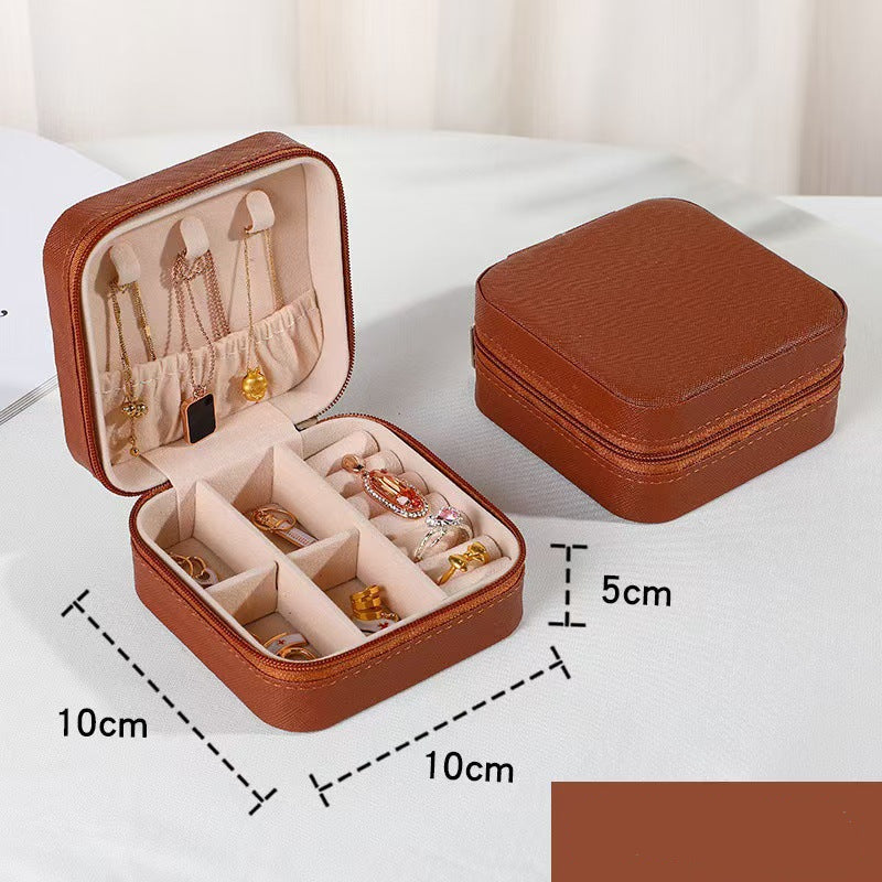 Brown jewelry box with open lid showing jewelry and dimensions on a white background